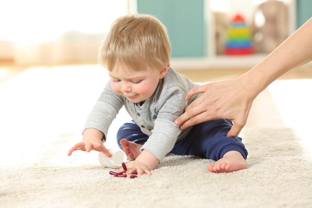 Mother-hand-preventing-the-baby-from-eating-pills