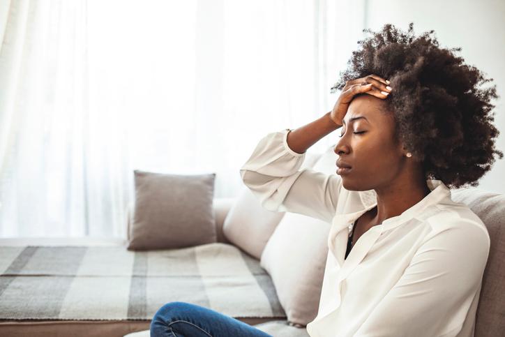 Shot-of-a-young-woman-suffering-from-a-headache.-1276385699_727x485