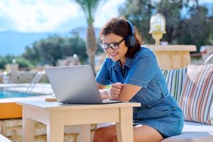 Business woman using headphones