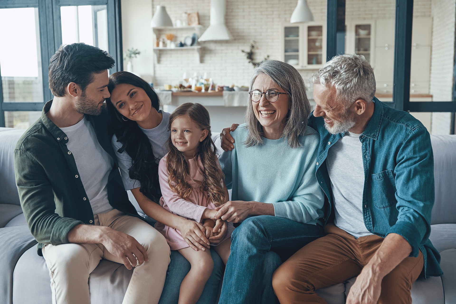 smiling-family-relaxes-together-on-a-comfortable-s-2026-03-23-22-56-03-utc